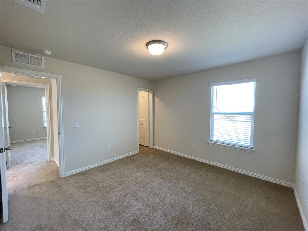 1805 Nelson Street Anna, TX 75409 - Photo 34 of 38 an empty room with windows and closet