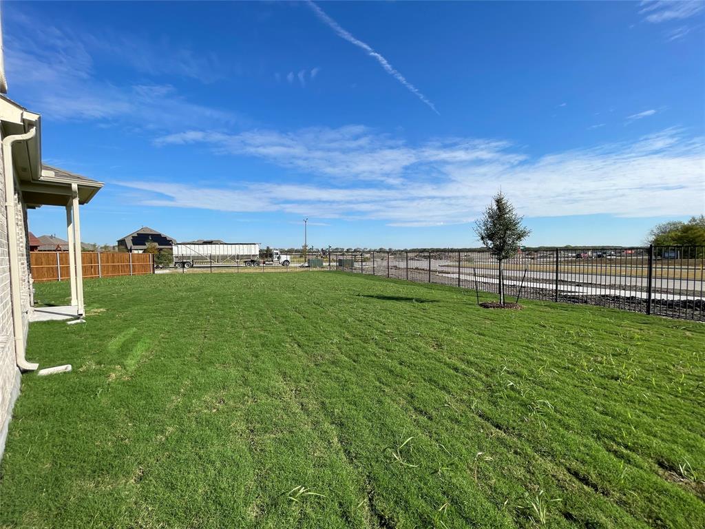1805 Nelson Street Anna, TX 75409 - Photo 36 of 38 a view of a yard with an outdoor space