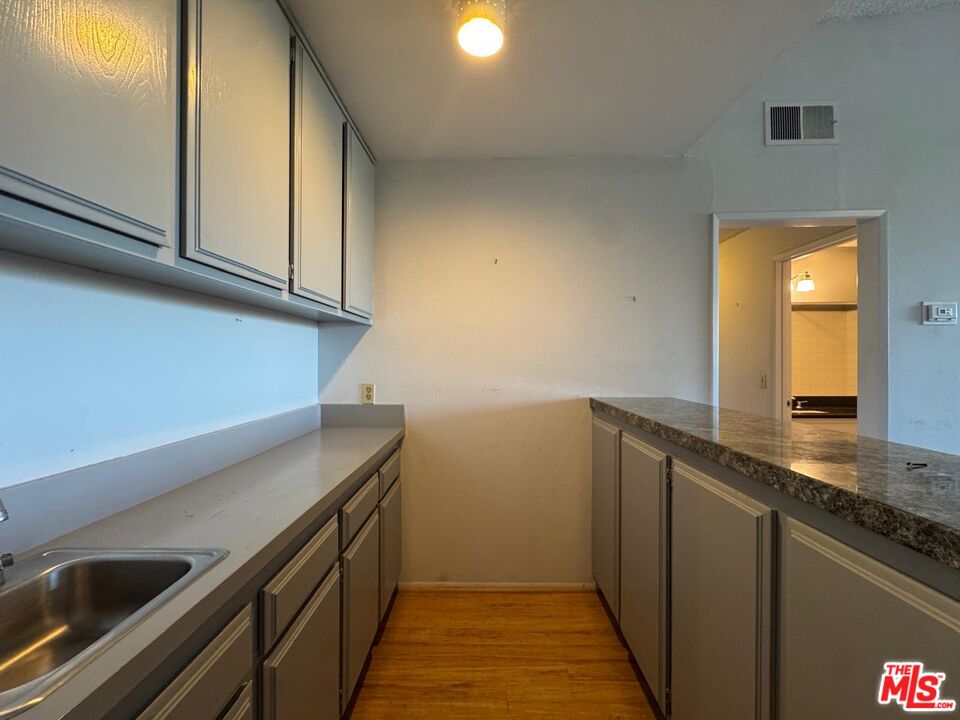 5100 Vía Dolce, Unit 305 Marina del Rey, CA 90292 - Photo 29 of 54 a view of a kitchen from the hallway
