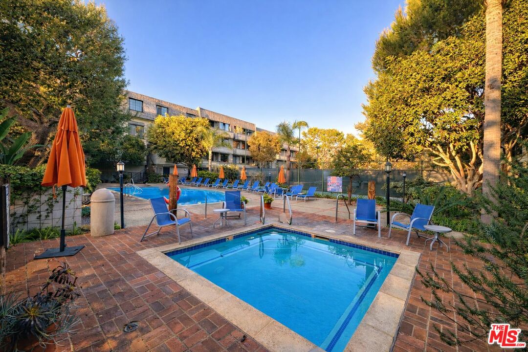 5100 Vía Dolce, Unit 305 Marina del Rey, CA 90292 - Photo 4 of 54 a view of a swimming pool with a patio