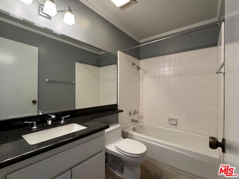 5100 Vía Dolce, Unit 305 Marina del Rey, CA 90292 - Photo 41 of 54 a bathroom with a sink and a mirror