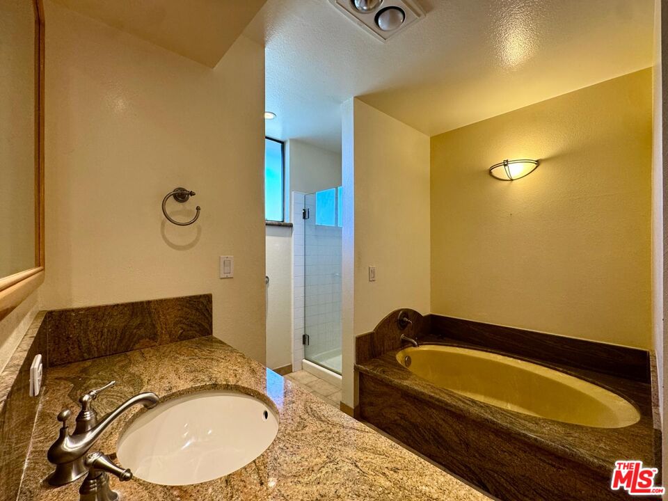 5100 Vía Dolce, Unit 305 Marina del Rey, CA 90292 - Photo 45 of 54 a bathroom with a bathtub and shower