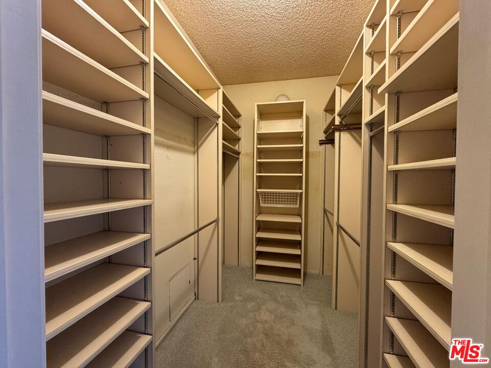 5100 Vía Dolce, Unit 305 Marina del Rey, CA 90292 - Photo 47 of 54 a view of walk in closet with empty racks