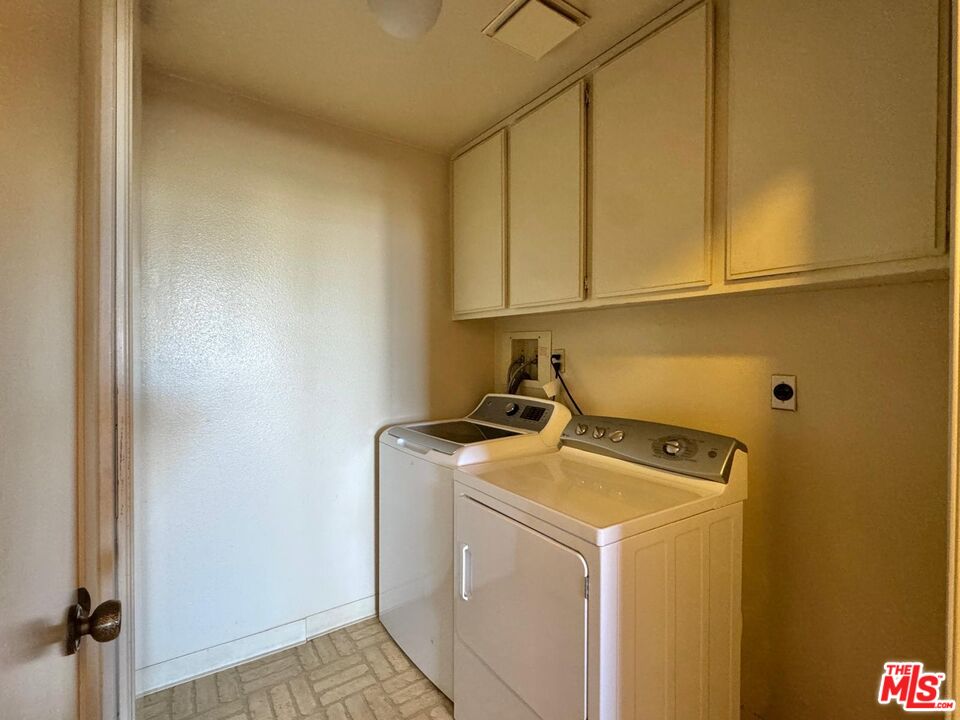 5100 Vía Dolce, Unit 305 Marina del Rey, CA 90292 - Photo 48 of 54 a utility room with dryer and washer