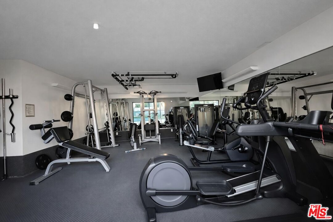 5100 Vía Dolce, Unit 305 Marina del Rey, CA 90292 - Photo 51 of 54 a view of a room with gym equipment