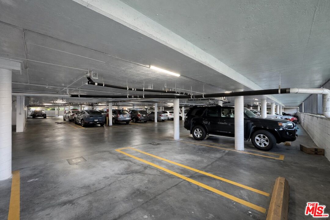 5100 Vía Dolce, Unit 305 Marina del Rey, CA 90292 - Photo 52 of 54 a view of a garage with parked cars