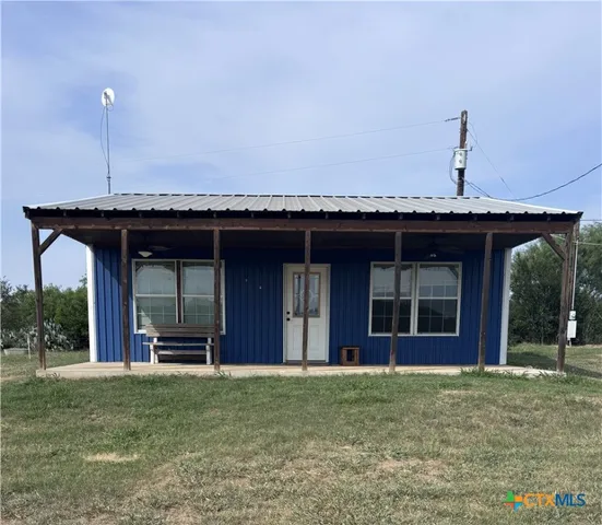 a room with a bed and furniture