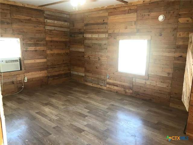 a kitchen with a stove and a refrigerator