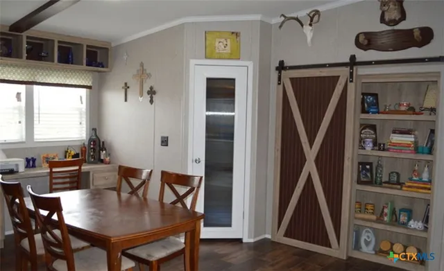 a view of a dining room with furniture