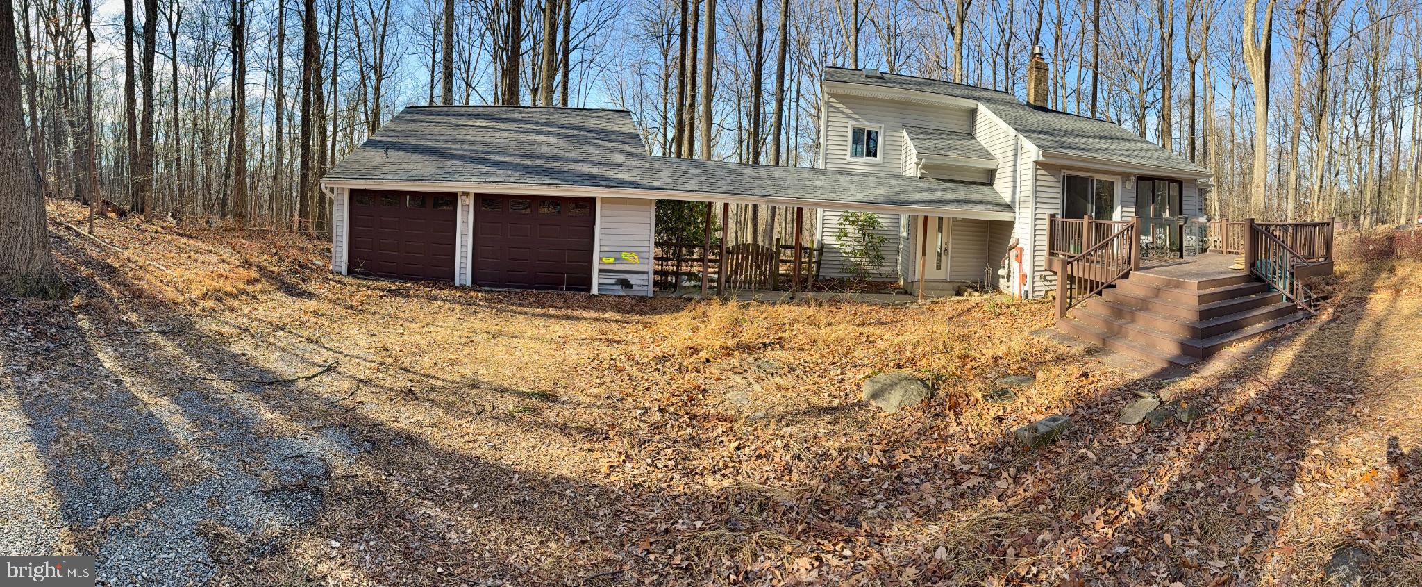 a view of a house with wooden fence