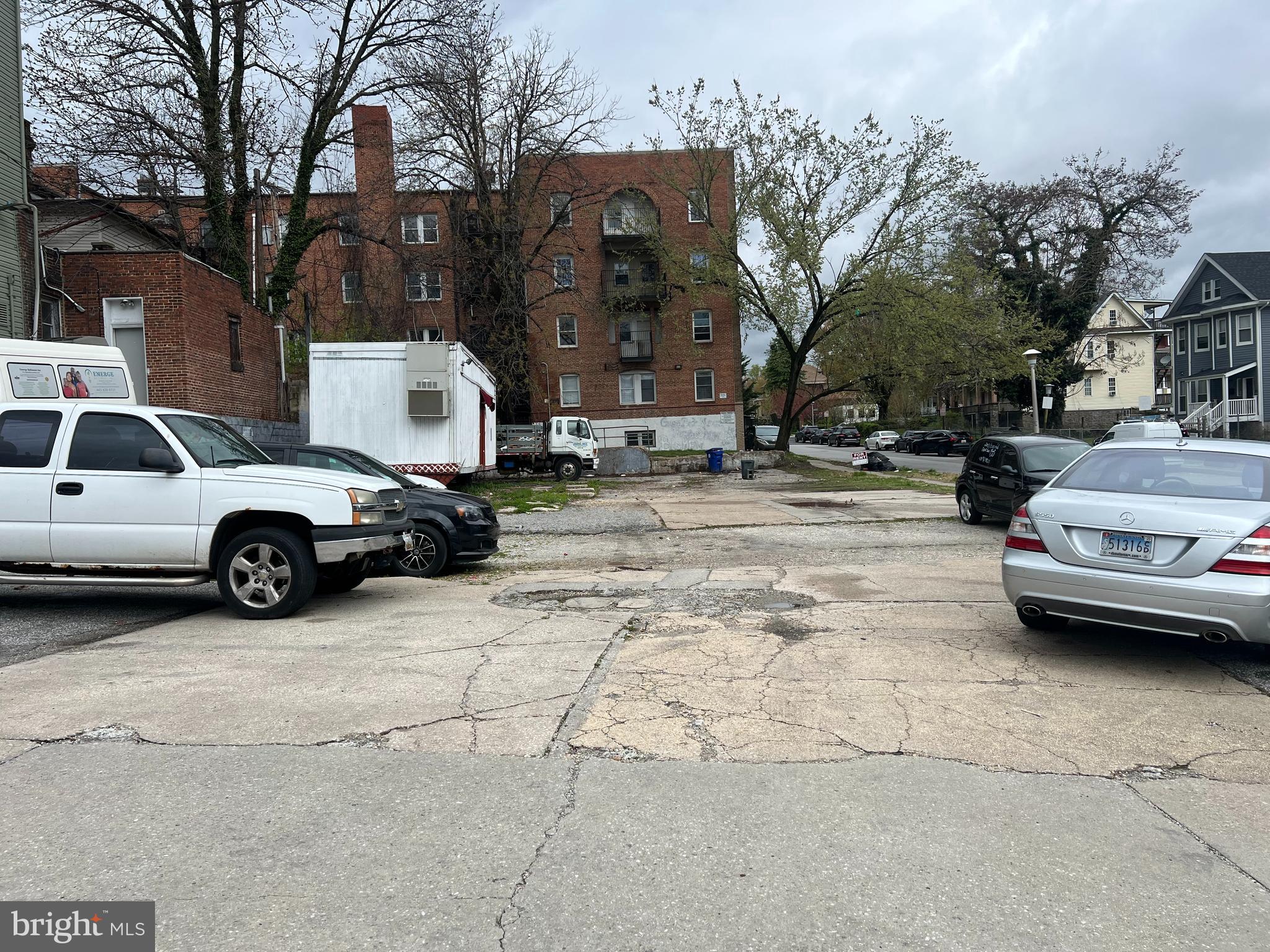2100 Denison Street Baltimore, MD 21216 - Photo 3 of 3 a view of a cars parked in a yard