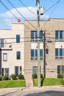 a view of a building with a street