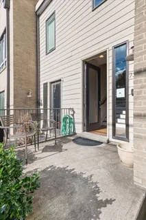 a backyard of a house with outdoor seating