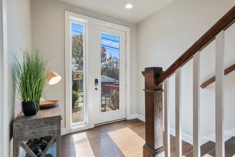 a view of entryway with wooden floor and a potted plant