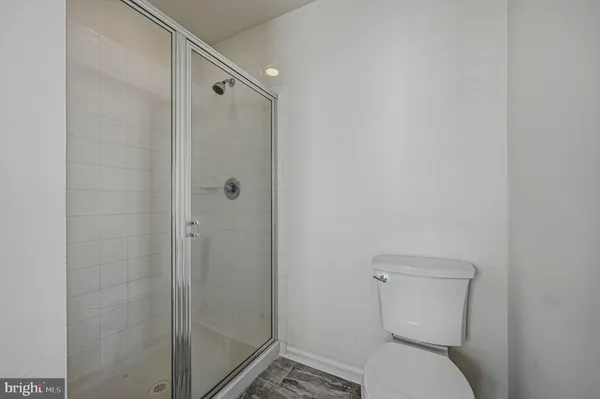 a bathroom with a tub a sink and mirror