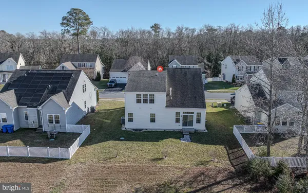 an aerial view of a house with outdoor space