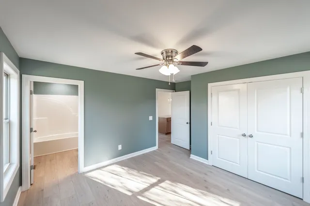 a view of a livingroom with a chandelier fan