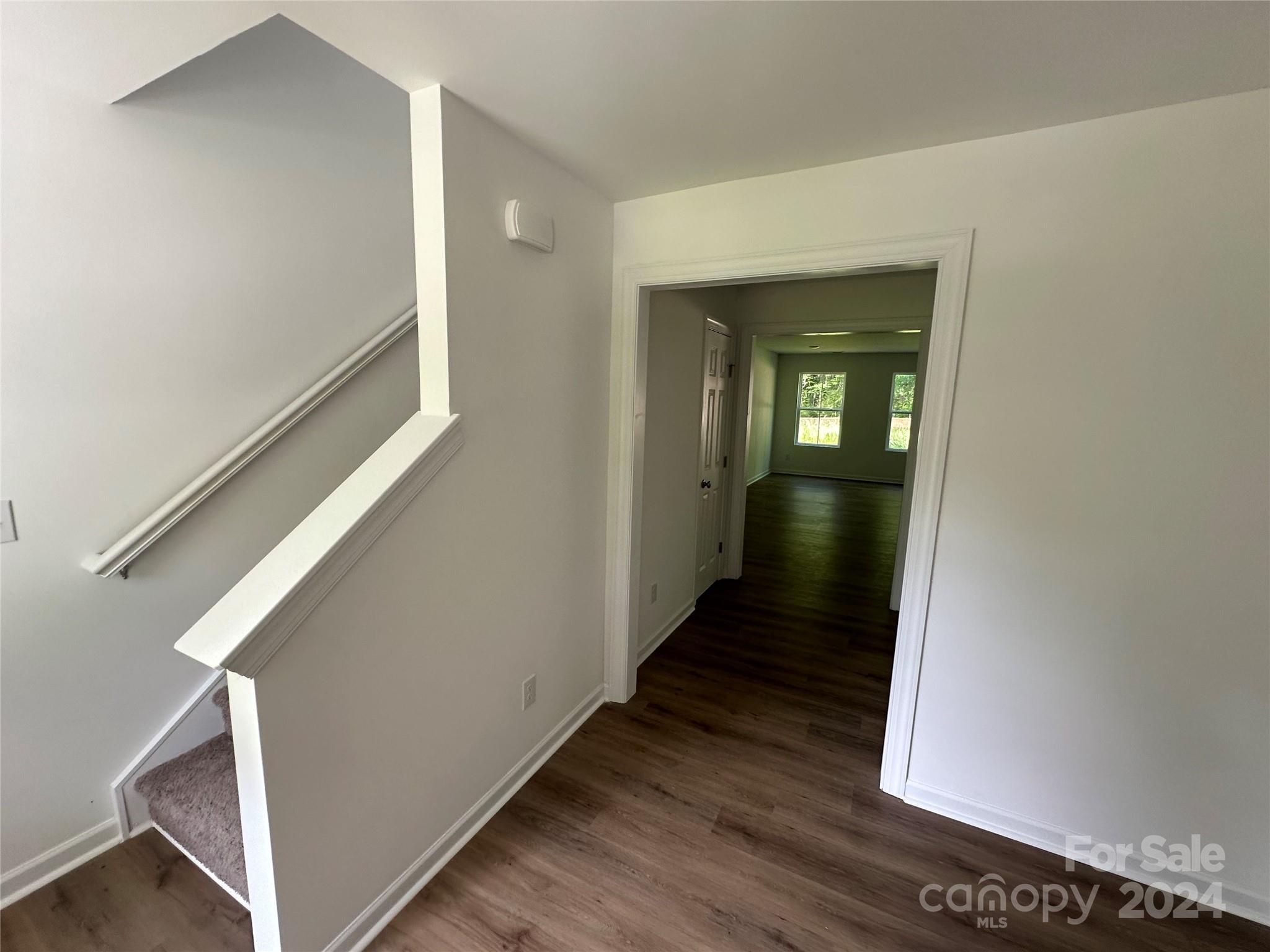 2433 Craig Farm Road Lancaster, SC 29720 - Photo 11 of 36 a view of a hallway with wooden floor and staircase