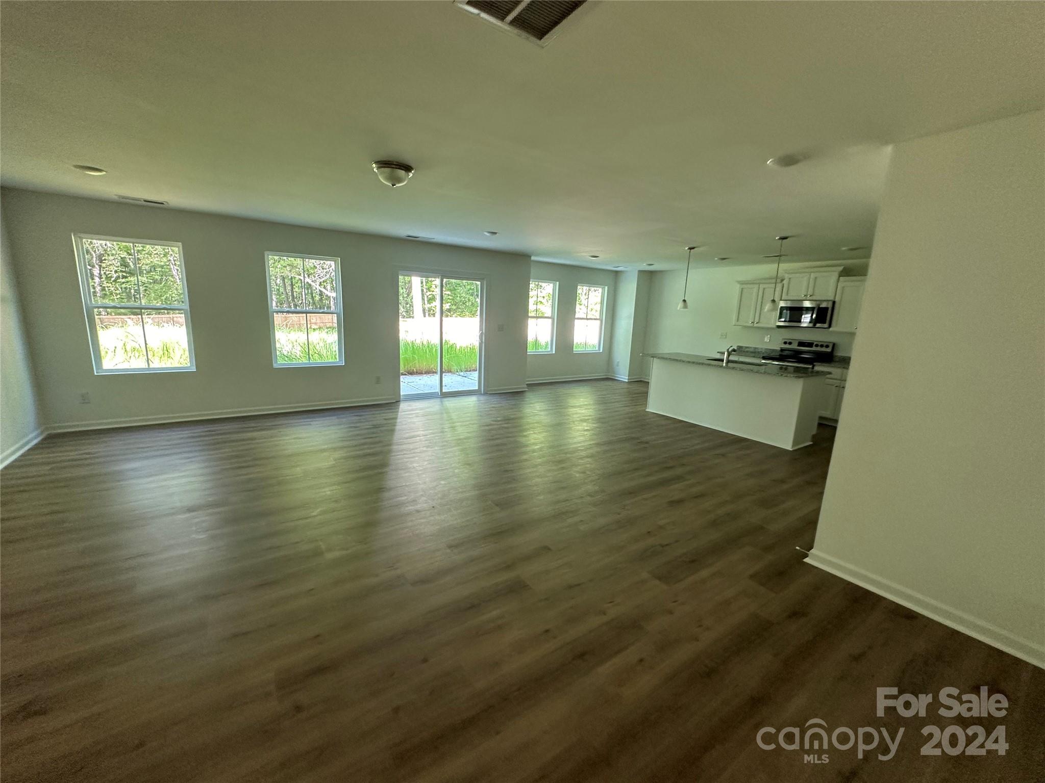 2433 Craig Farm Road Lancaster, SC 29720 - Photo 13 of 36 an empty room with wooden floor and windows