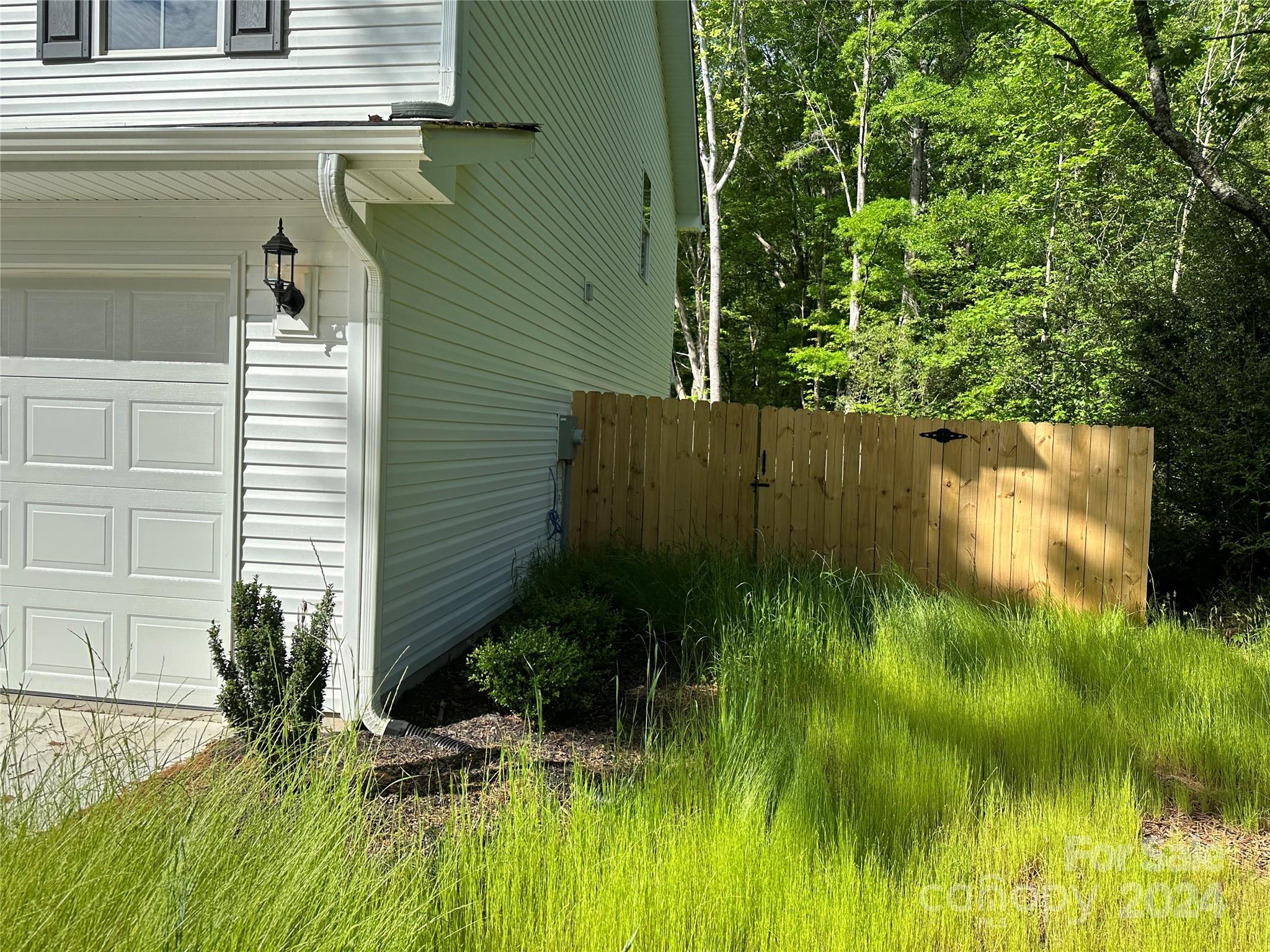 2433 Craig Farm Road Lancaster, SC 29720 - Photo 6 of 36 a view of a backyard of a house with a plants and trees