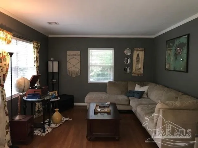 a living room with furniture and a window