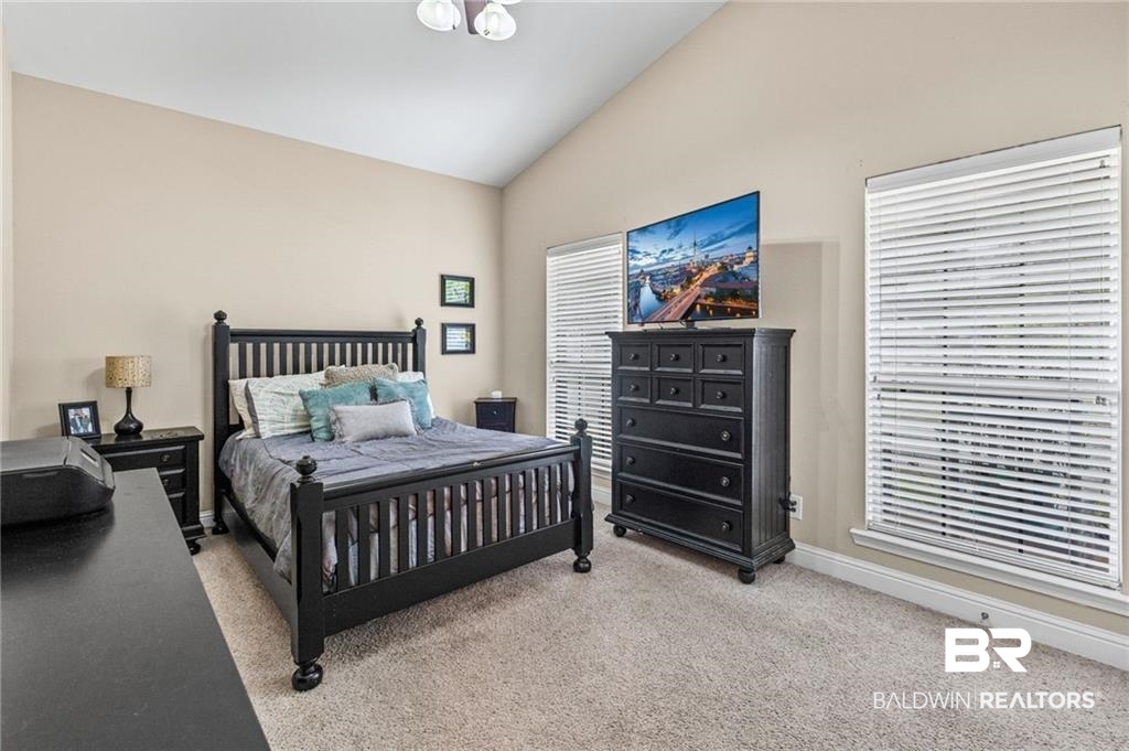 2570 Pecan Pointe Drive Semmes, AL 36575 - Photo 13 of 22 Bedroom featuring lofted ceiling and light carpet