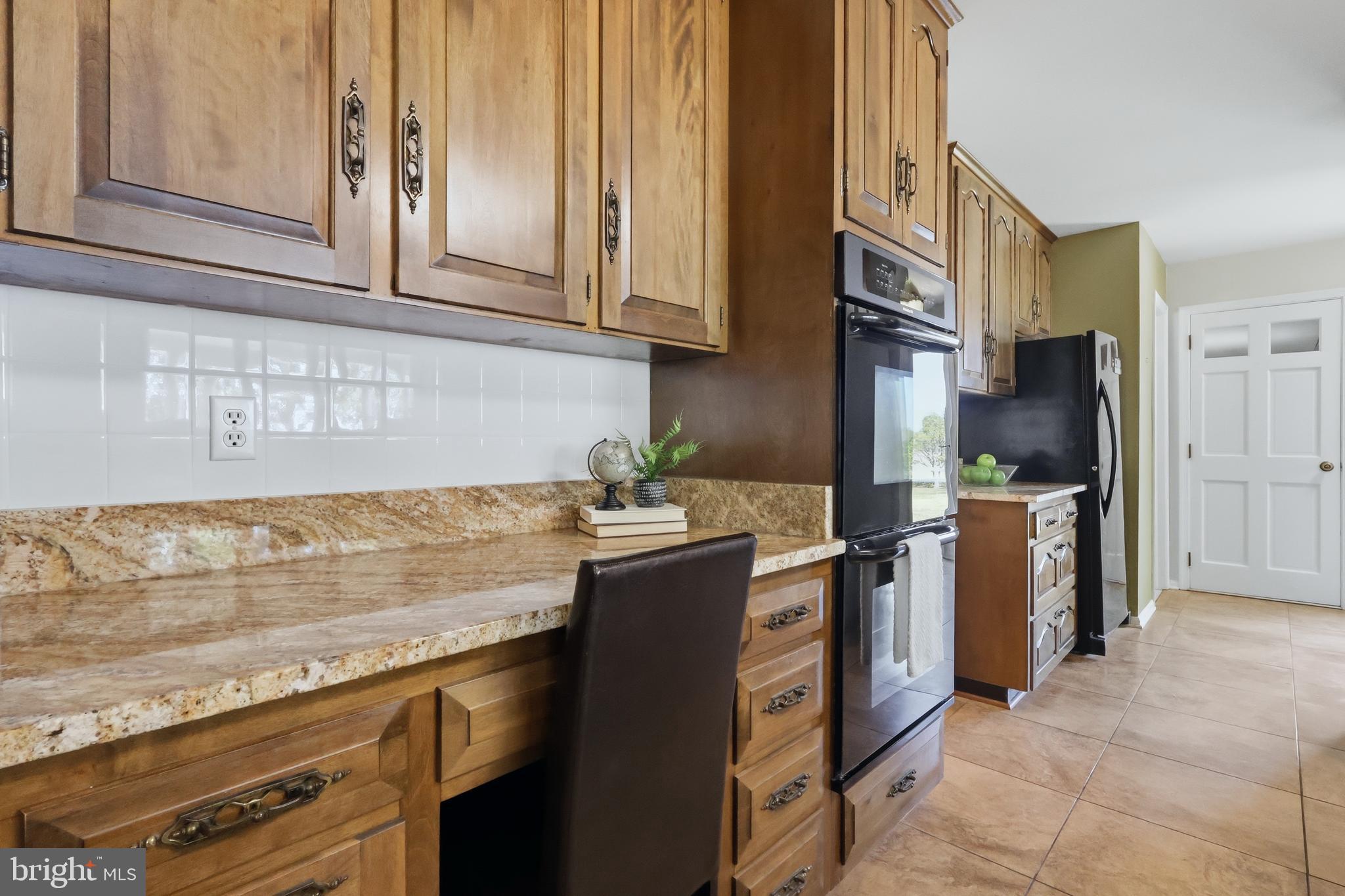23500 River Road Lexington Park, MD 20653 - Photo 22 of 92 a kitchen with stainless steel appliances granite countertop a sink stove and refrigerator