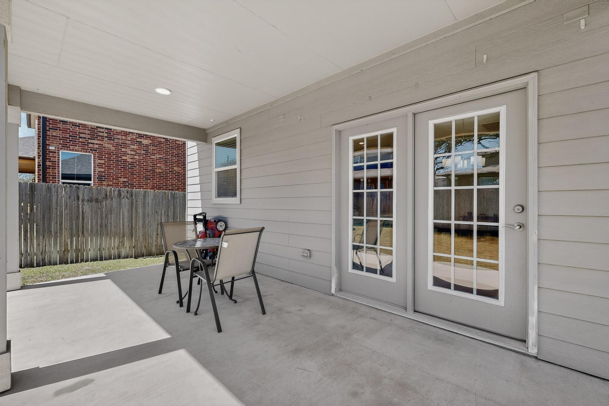712 Madalin Rue Court Leander, TX 78641 - Photo 23 of 28 View of patio featuring outdoor dining area