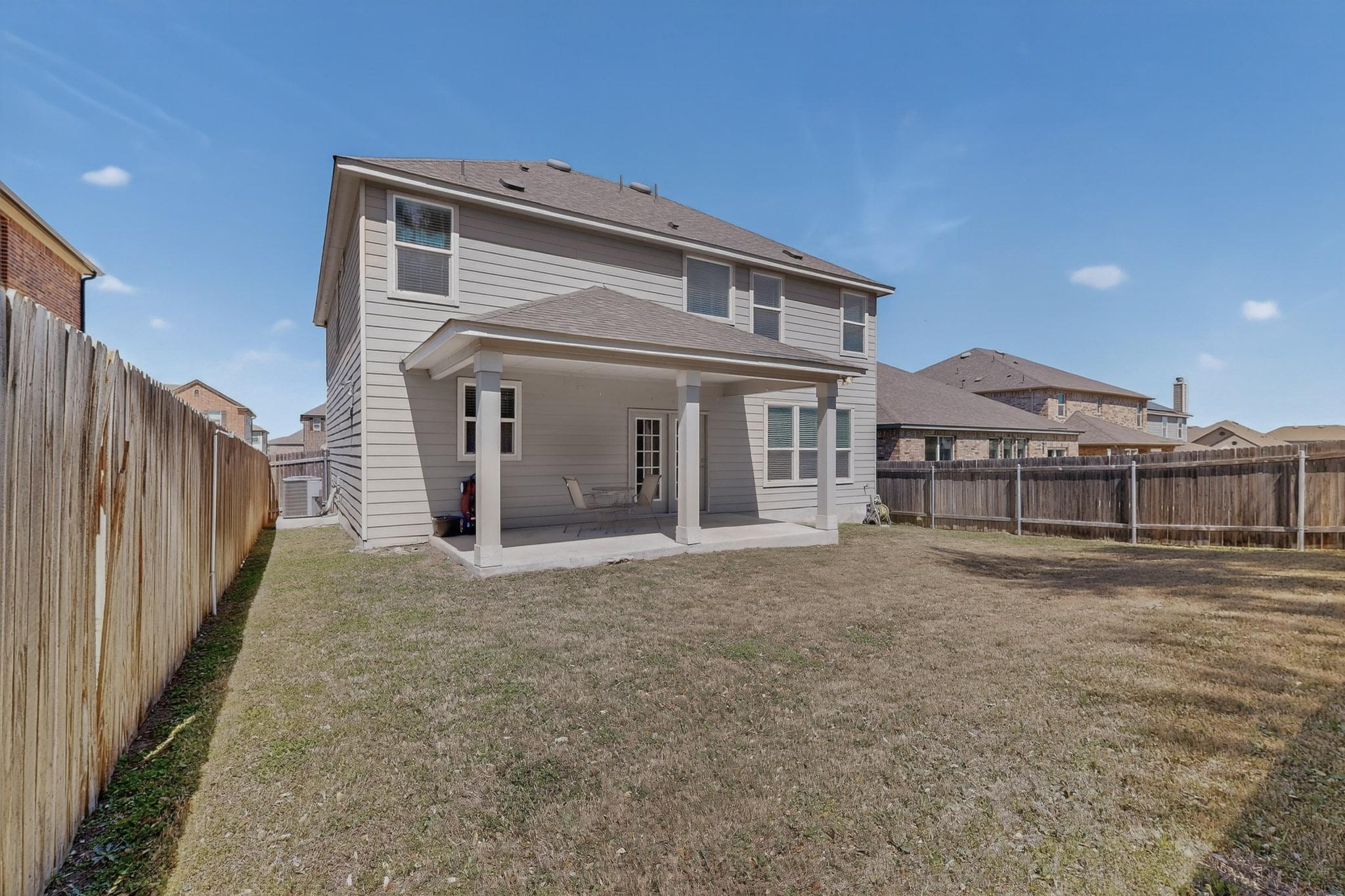 712 Madalin Rue Court Leander, TX 78641 - Photo 27 of 28 Rear view of house featuring a patio area and a fenced backyard