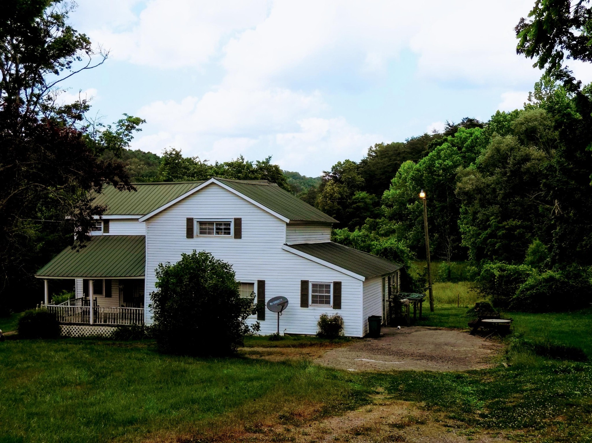 516 Possum Valley Road Maynardville, TN 37807 - Photo 5 of 15 a front view of a house with a garden and trees