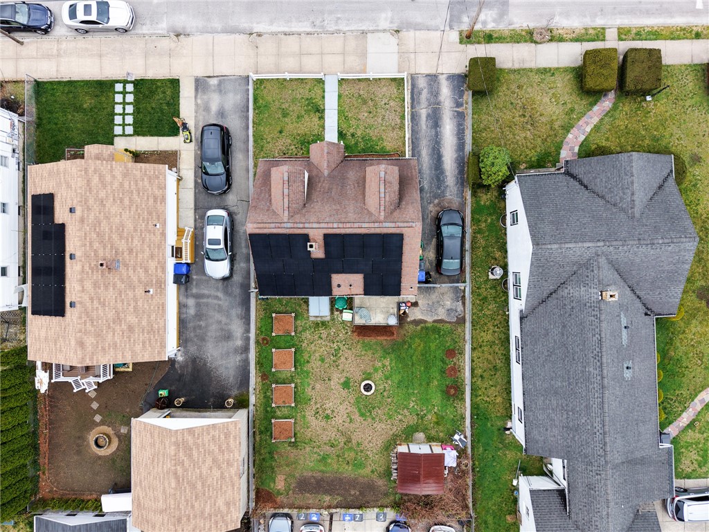 220 Shawmut Avenue Central Falls, RI 02863 - Photo 23 of 25 Bird's eye view showing fenced backyard and placement of solar panels.