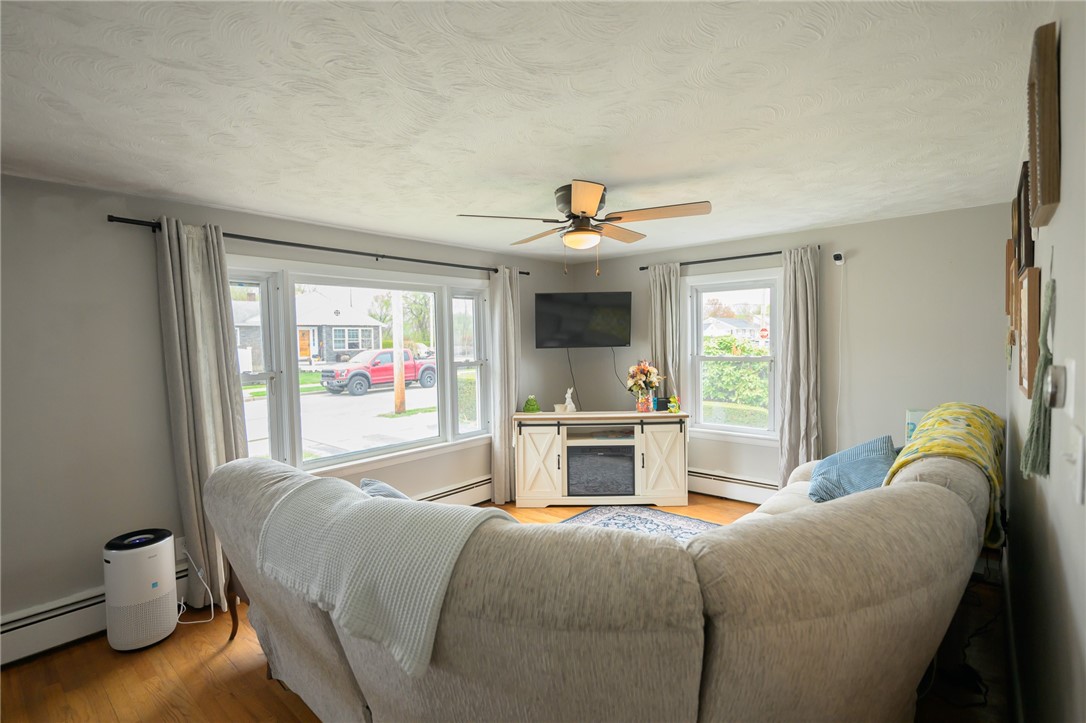 220 Shawmut Avenue Central Falls, RI 02863 - Photo 5 of 25 This sun filled family room complete with a picturesque bay window.