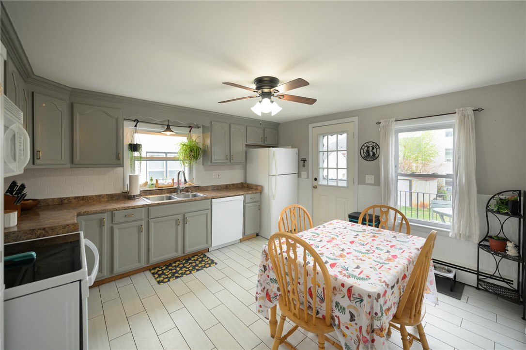 220 Shawmut Avenue Central Falls, RI 02863 - Photo 6 of 25 The heart of the home is this delightful eat-in-kitchen. Door leads to deck to back yard.