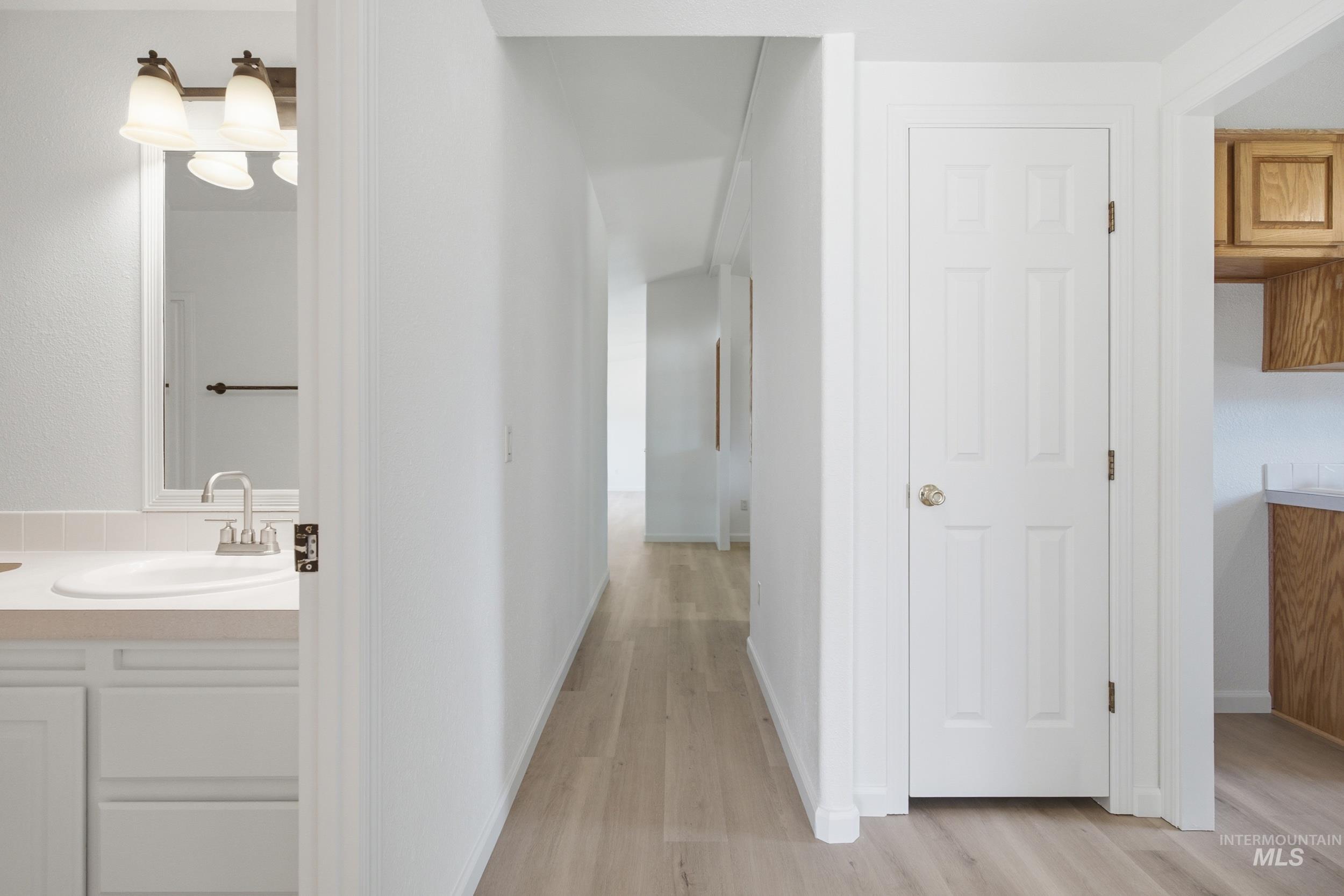 7422 Track Road Nampa, ID 83686 - Photo 30 of 50 Room featuring light-colored carpeting, white walls, and a ceiling-mounted light fixture