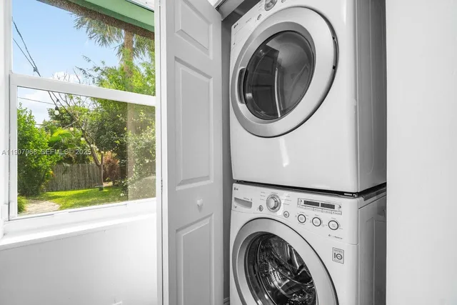 a view of a washer and dryer in a balcony