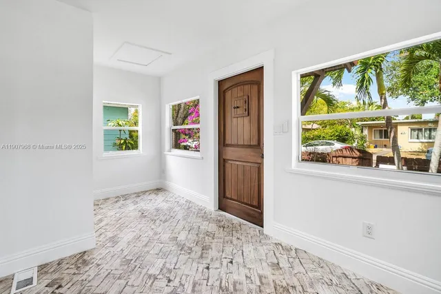 wooden floor in a room with a window