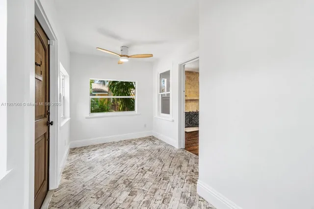 a view of an empty room with a window