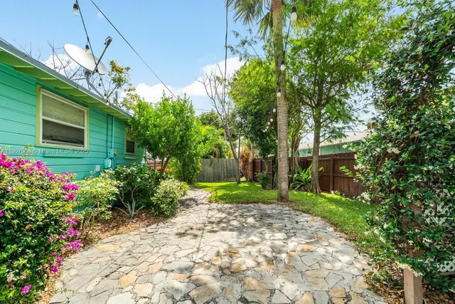 a view of a backyard with plants