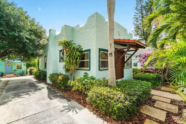 a view of a potted plants in front of a house