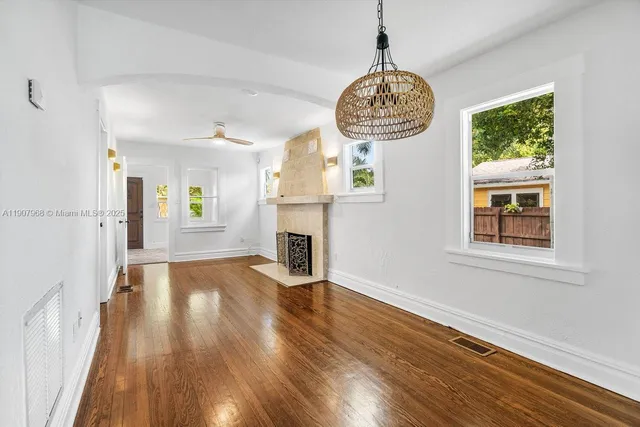 a view of an entryway with wooden floor
