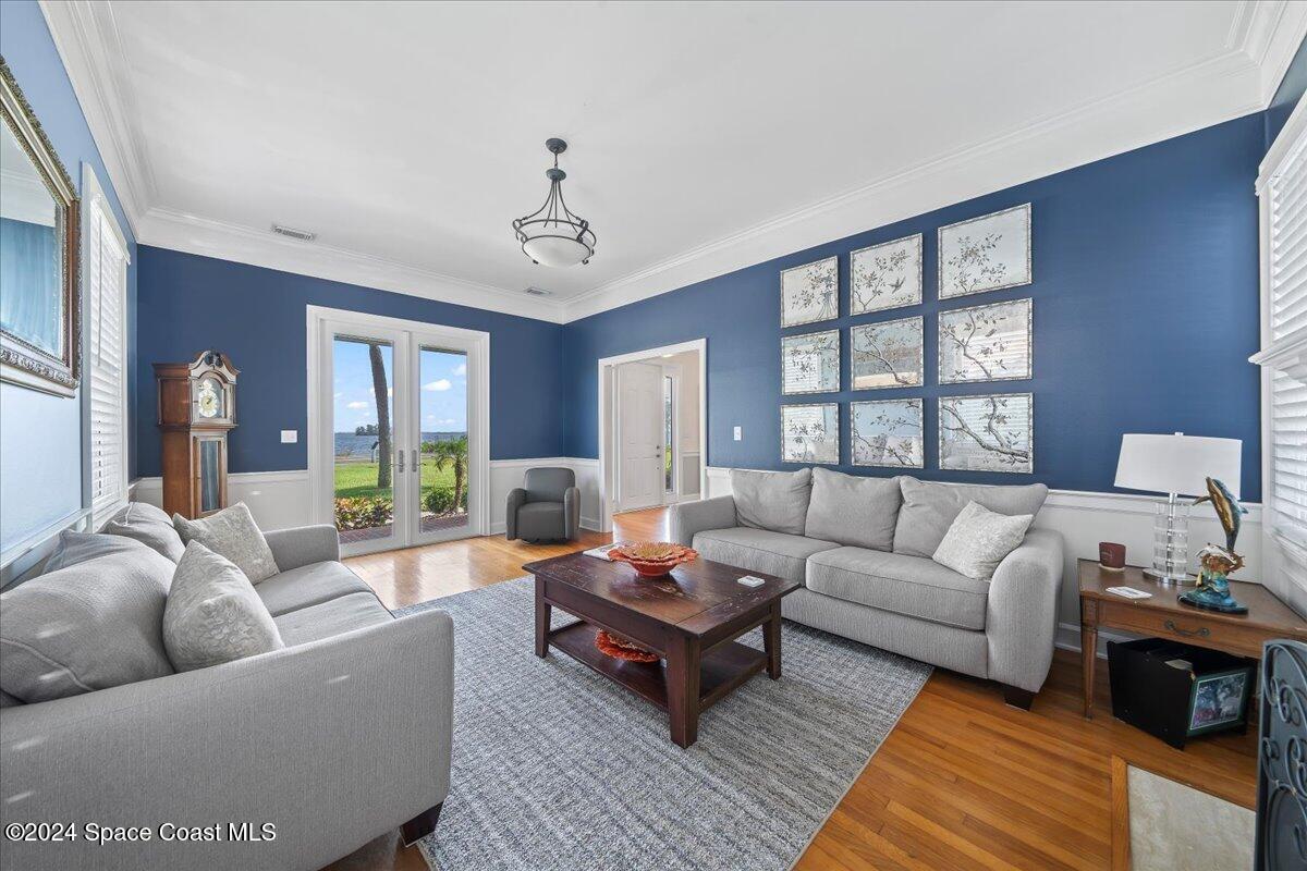 2420 Rocky Point Road Malabar, FL 32950 - Photo 22 of 97 a living room with furniture and a large window