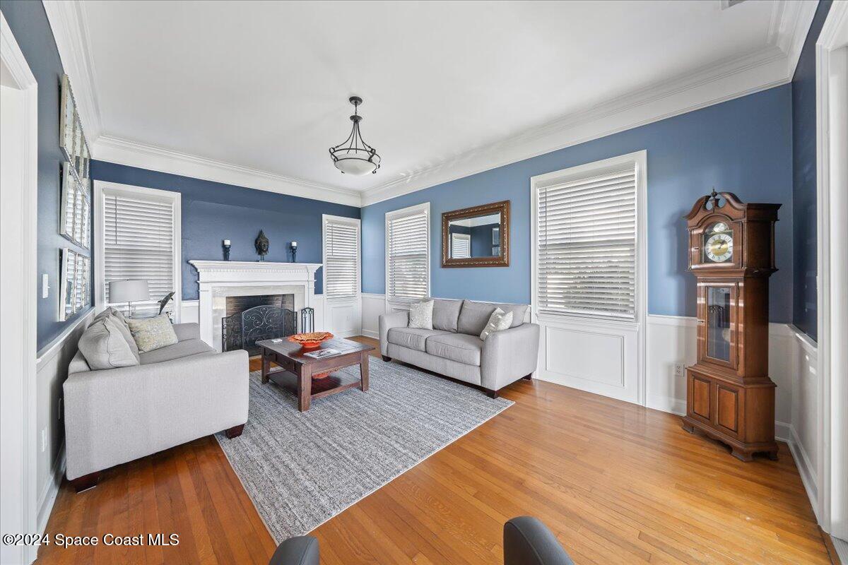 2420 Rocky Point Road Malabar, FL 32950 - Photo 23 of 97 a living room with furniture fireplace and a window
