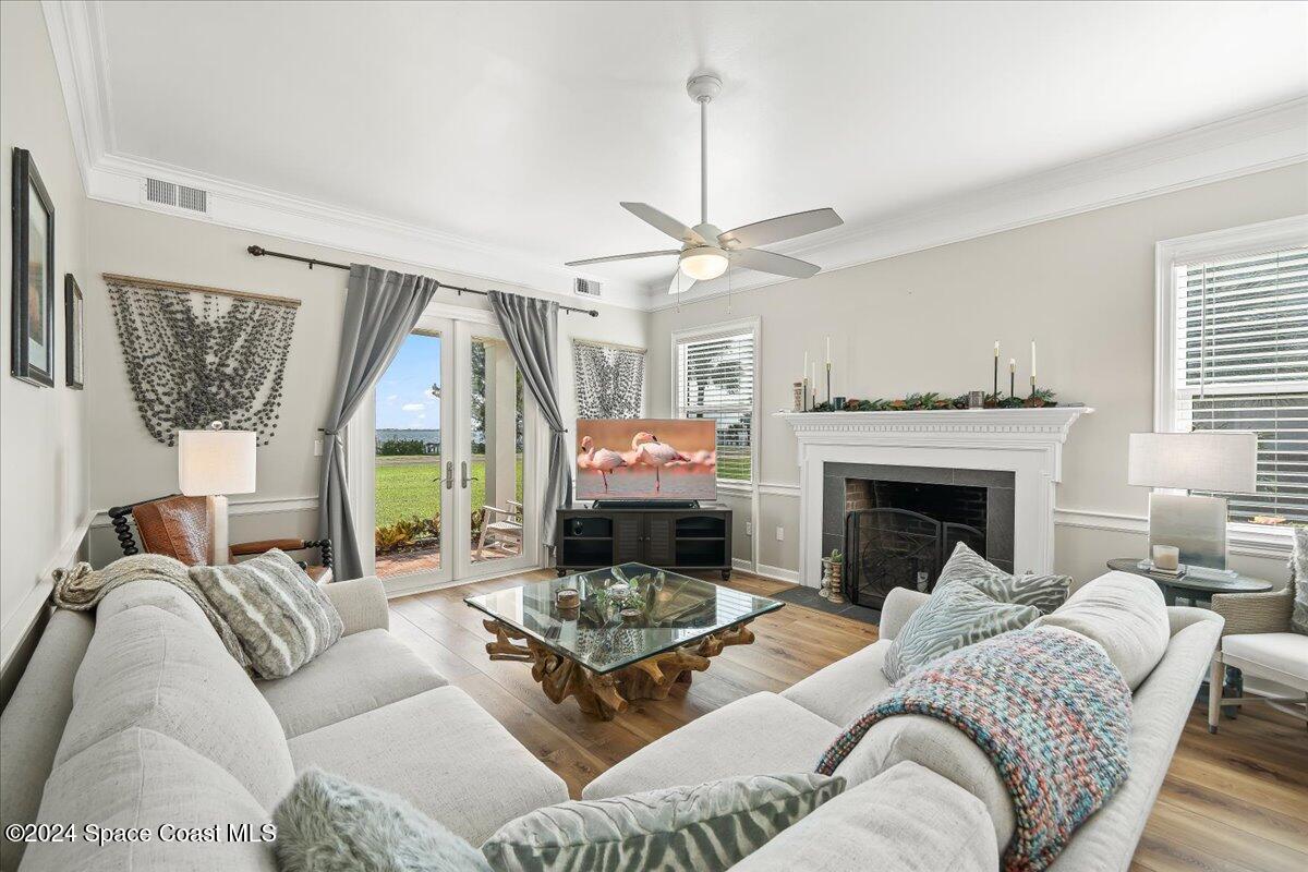 2420 Rocky Point Road Malabar, FL 32950 - Photo 27 of 97 a living room with furniture and a fireplace