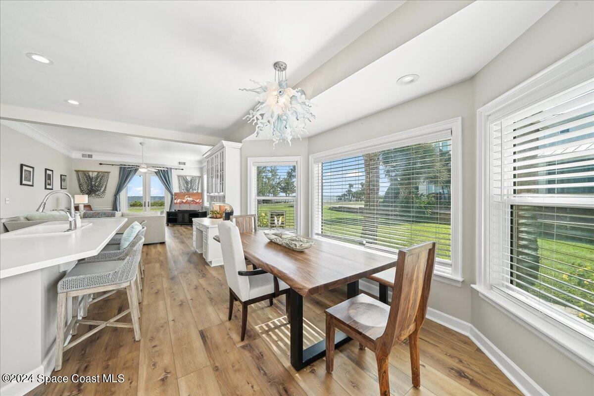 2420 Rocky Point Road Malabar, FL 32950 - Photo 30 of 97 a dining room with furniture window and wooden floor
