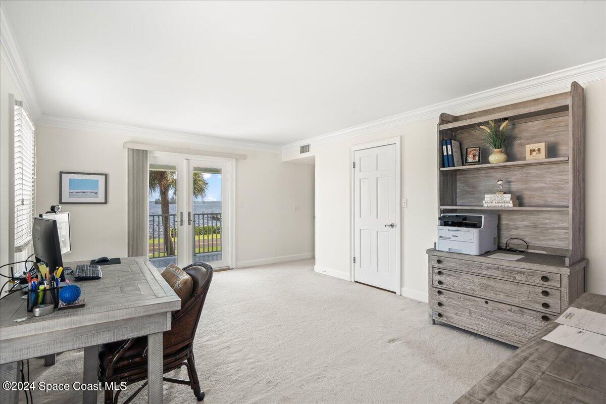 2420 Rocky Point Road Malabar, FL 32950 - Photo 43 of 97 a view of a workspace with furniture