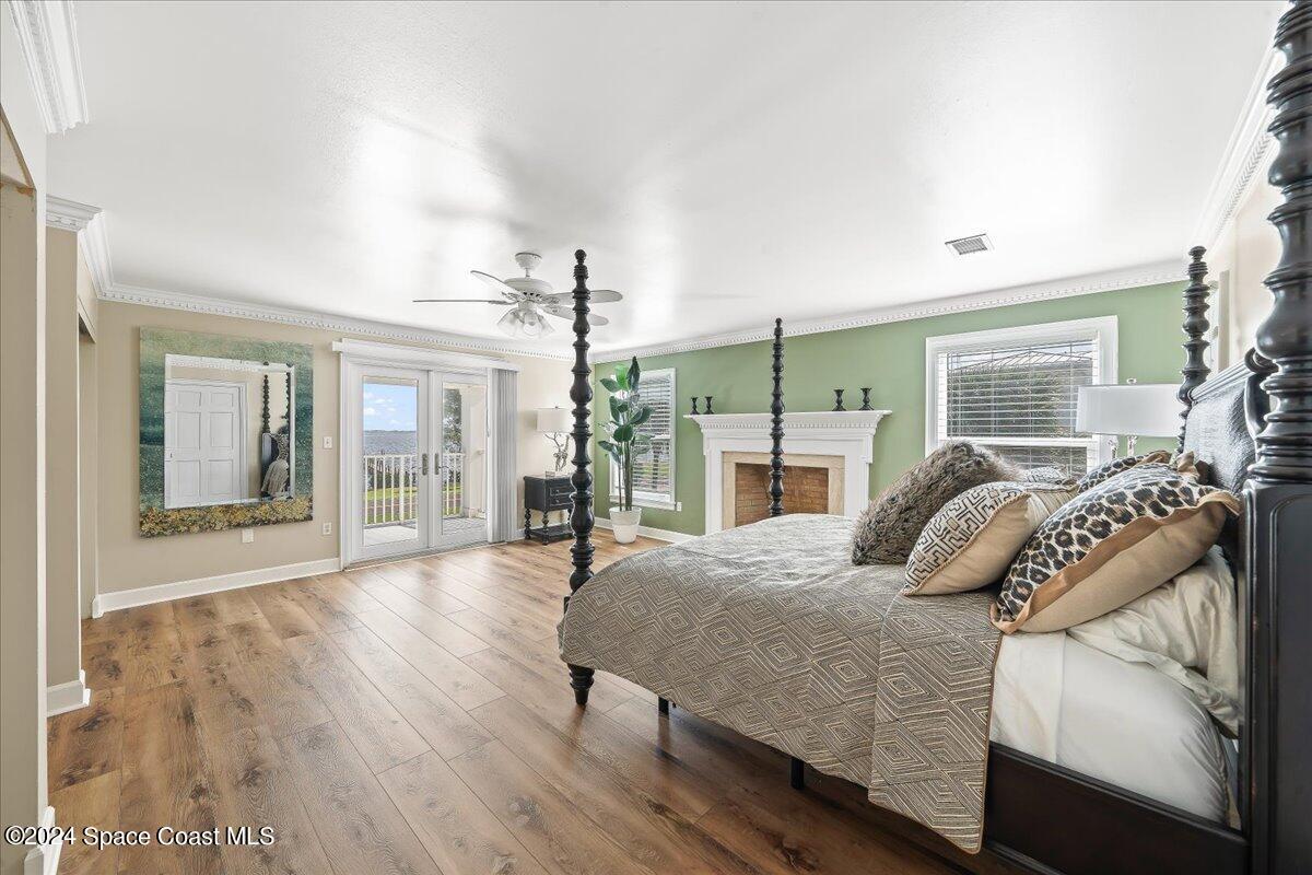 2420 Rocky Point Road Malabar, FL 32950 - Photo 45 of 97 a bedroom with a large bed and a large window