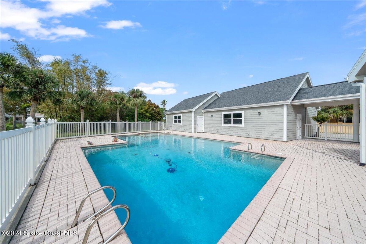 2420 Rocky Point Road Malabar, FL 32950 - Photo 71 of 97 swimming pool view with a outdoor space