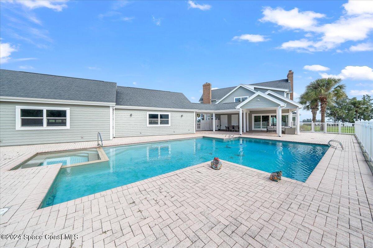 2420 Rocky Point Road Malabar, FL 32950 - Photo 8 of 97 a view of a house with a swimming pool