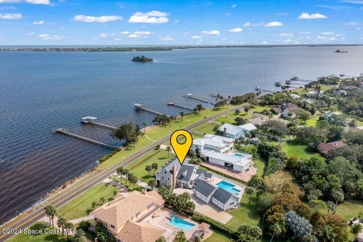 2420 Rocky Point Road Malabar, FL 32950 - Photo 96 of 97 an aerial view of a house with a swimming pool and outdoor seating