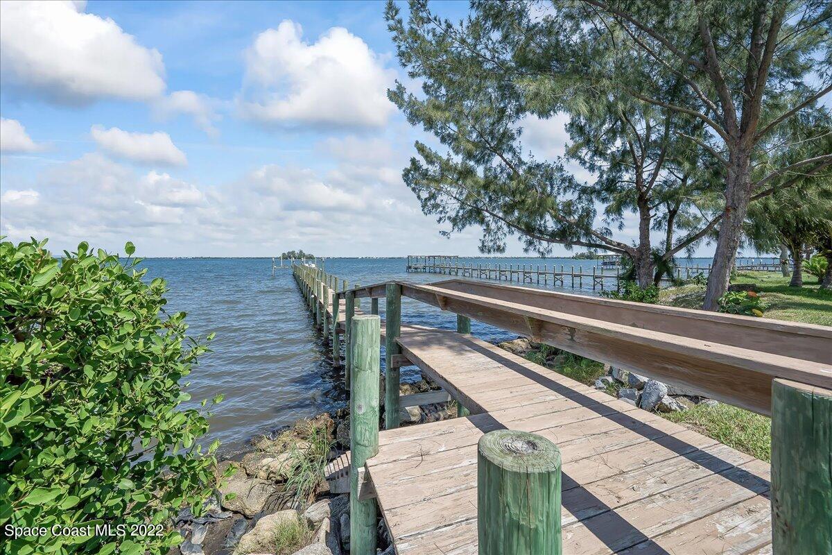 2420 Rocky Point Road Malabar, FL 32950 - Photo 10 of 97 a view of a balcony with wooden fence